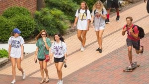 ECU students walk and skateboard to class