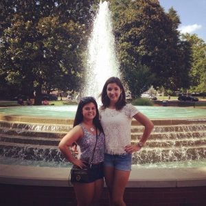 Two female roommates by the Turstees Fountain