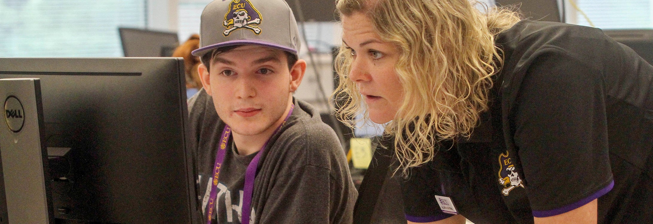 Daniel Martin Coffey, an incoming freshman to ECUís College of Engineering and Technoloy from Charlotte, gets some help with his schedule from academic advisor Allison Winters during orientation on Tuesday, June 11, 2019, in the Science and Technology Building