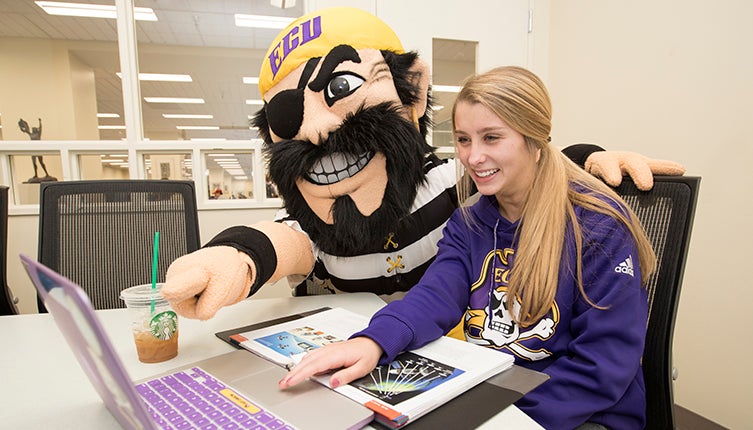 PeeDee helps student with laptop