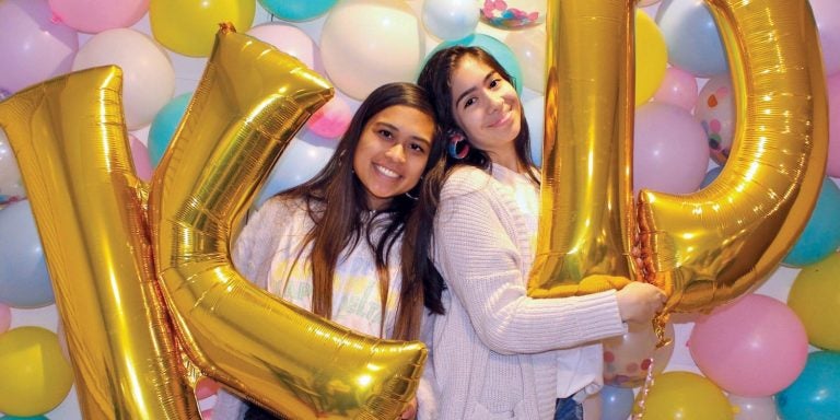 Kappa Delta girls prepare for a party with balloon decorations