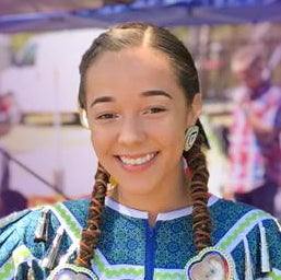 Native American student, Caitlin Harrison, poses in traditional dress
